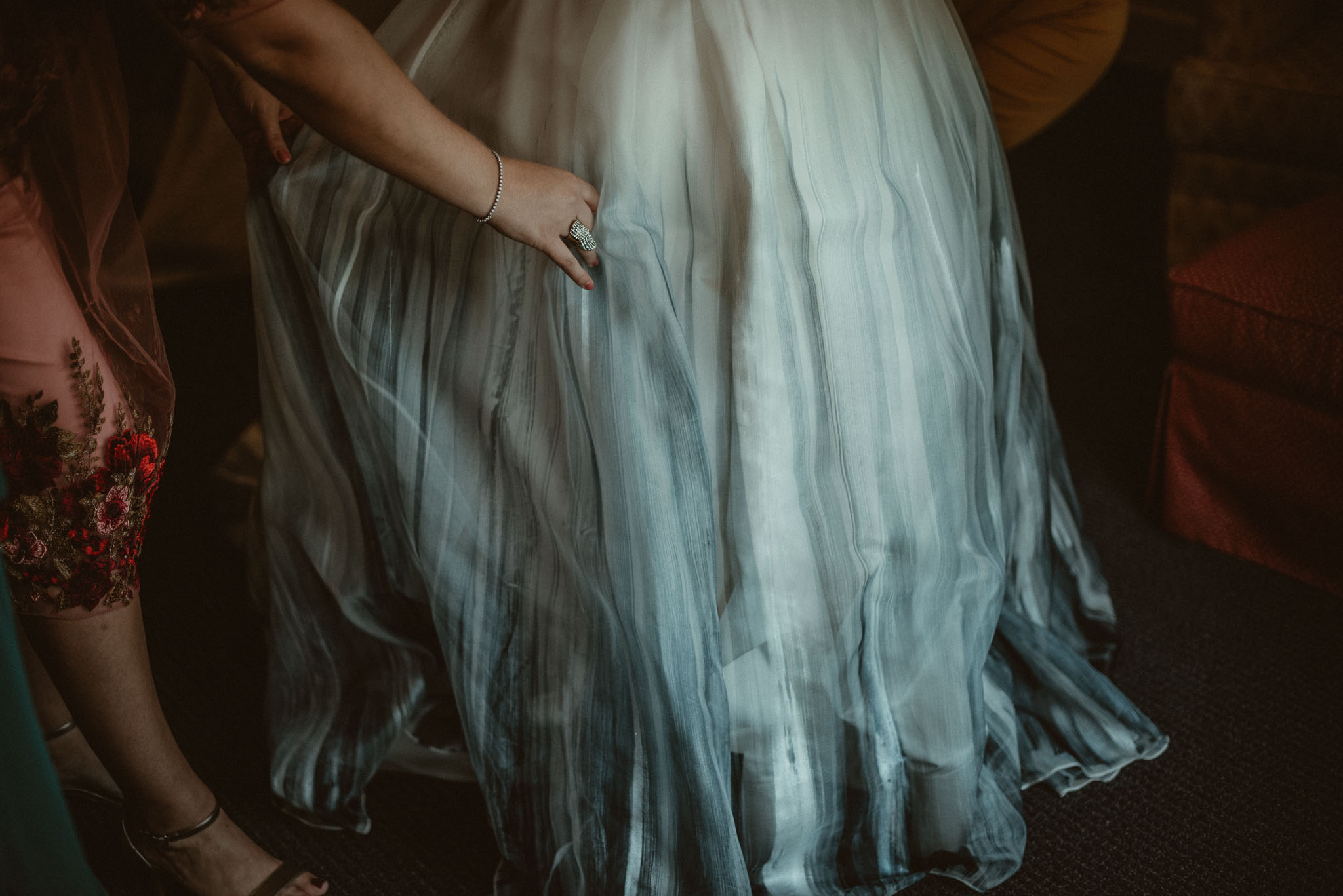 Close up of the brides blue dipped wedding dress skirt