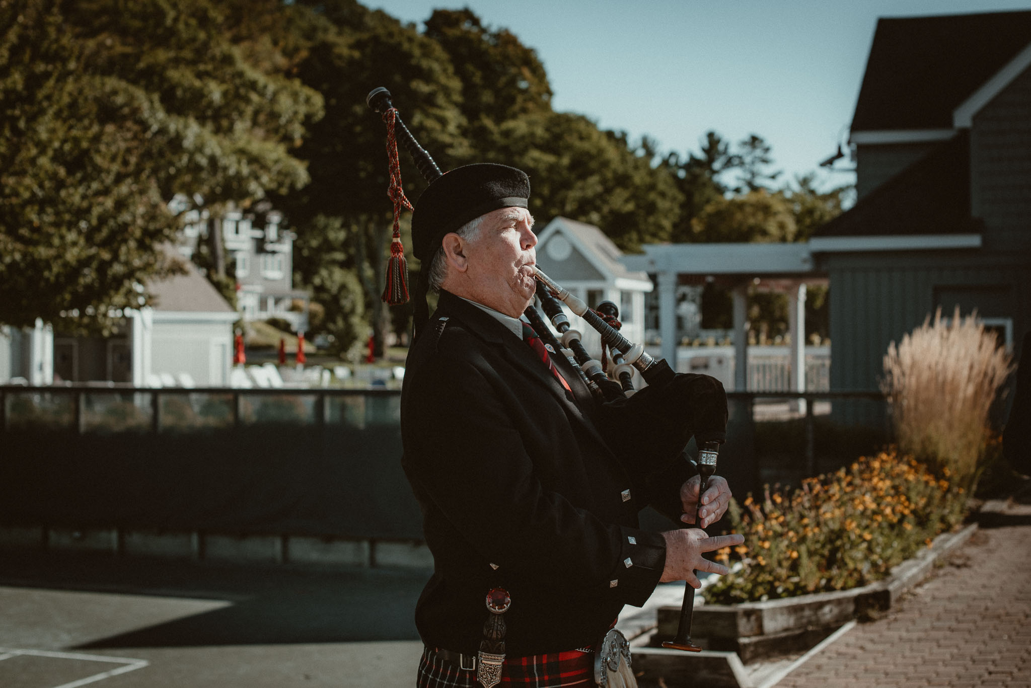Bagpiper performing during the ceremony exit.