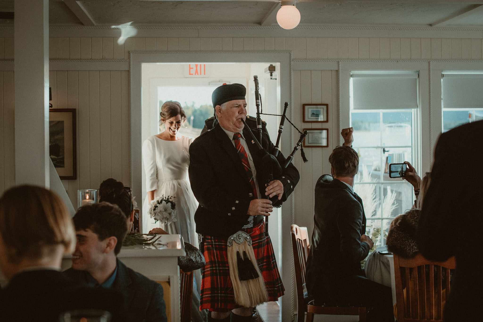 Bagpiper leading the couple into the Cafe Manitou for their grand entrance.