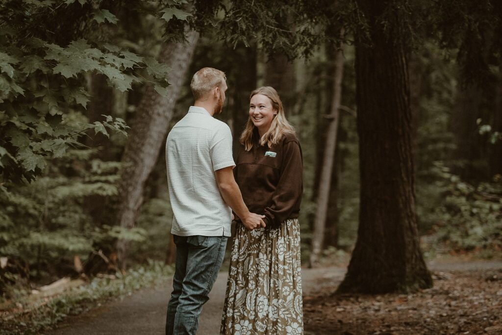 Couple standing together moments before his surprise proposal.