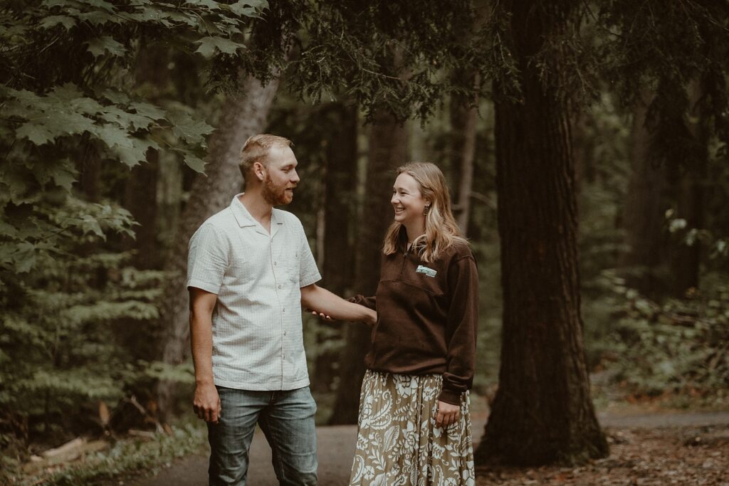 Couple standing together moments before his surprise proposal.