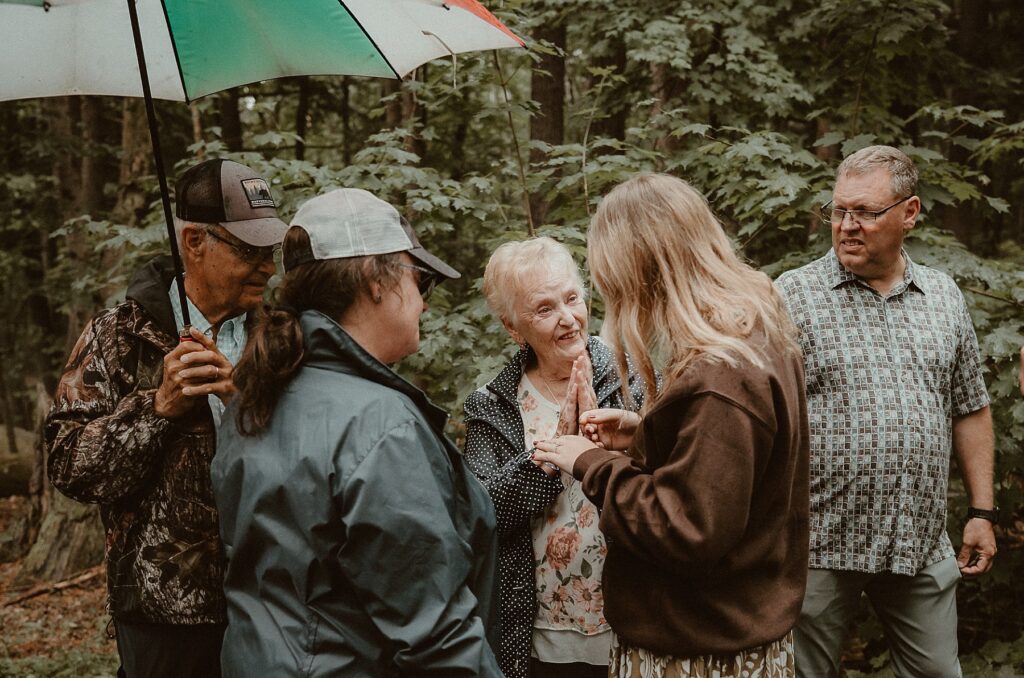Grandmother excited and admiring her granddaughters engagement ring.