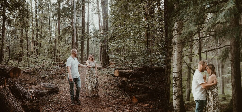 Couple being playful with each other in the woods.