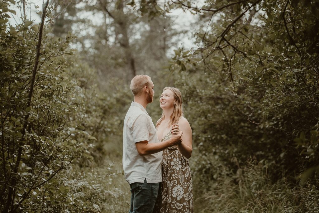 Couple dancing together in nature.