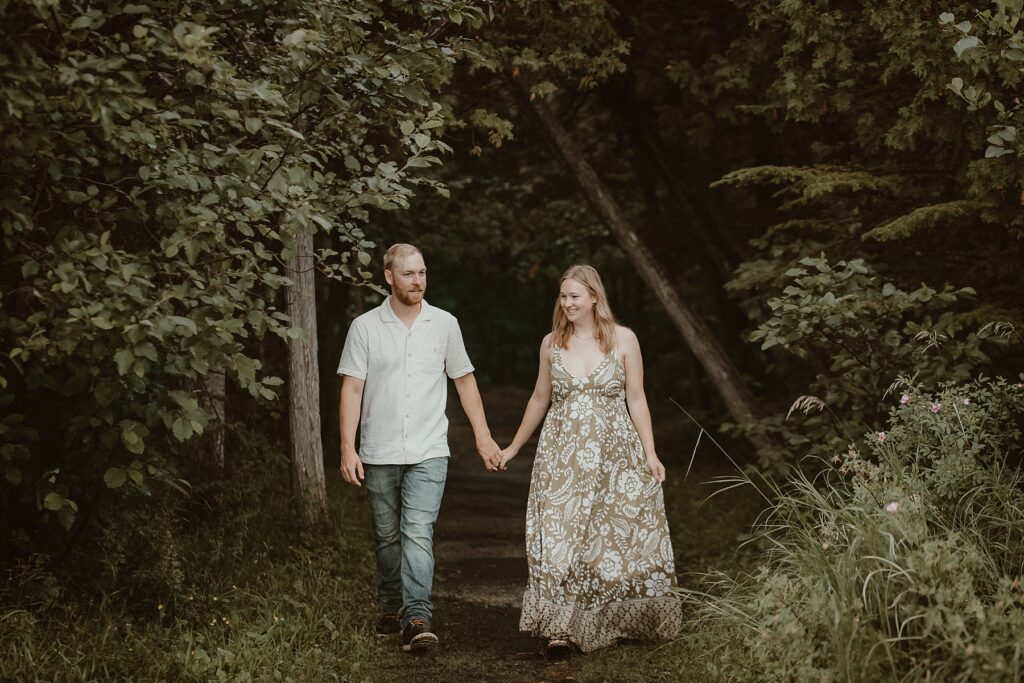 Couple walking together holding hands.