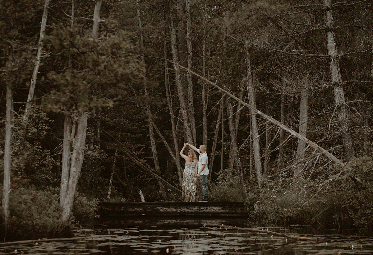 GIF of him twirling her on the dock.