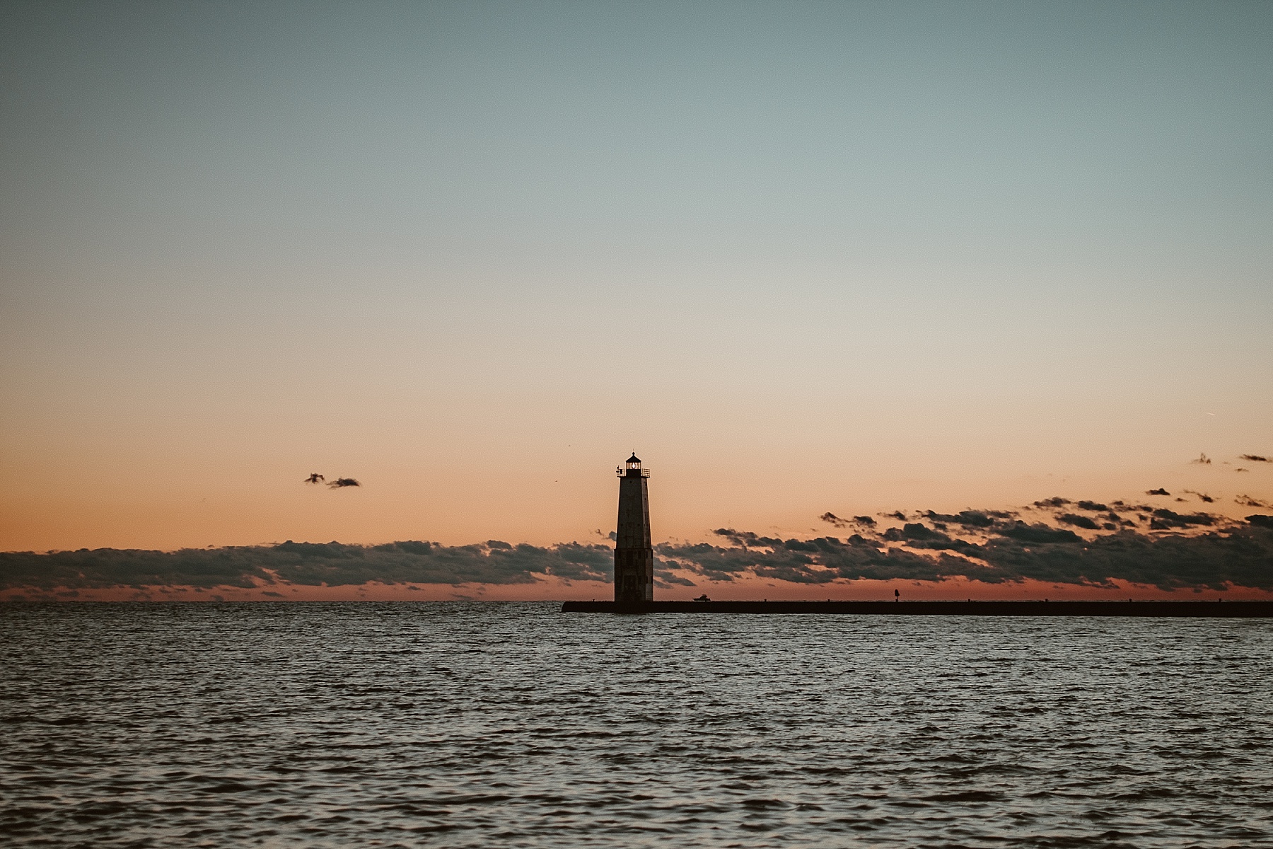 Frankfort Light glowing in the warm sunset light on Lake Michigan.