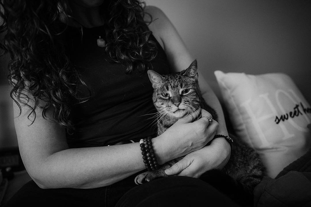 Photographer Shonda Michelson holding her cat, Jake.